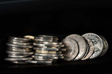 Stack of coins on dark background