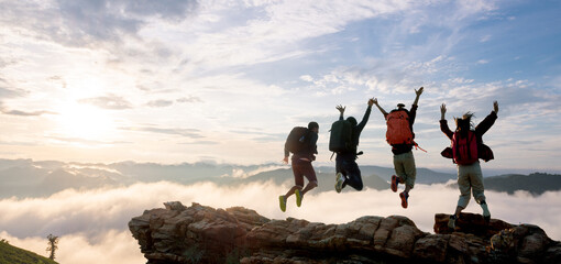 Group of happy hiker jumping on the hill - obrazy, fototapety, plakaty