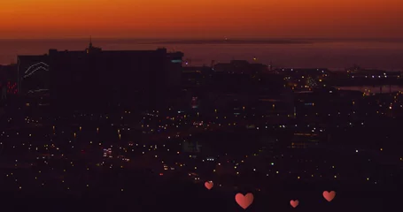 Keuken spatwand met foto Floating hearts over a nighttime cityscape © vectorfusionart