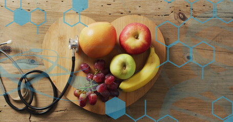 Image of chemical structures over stethoscope and fruit