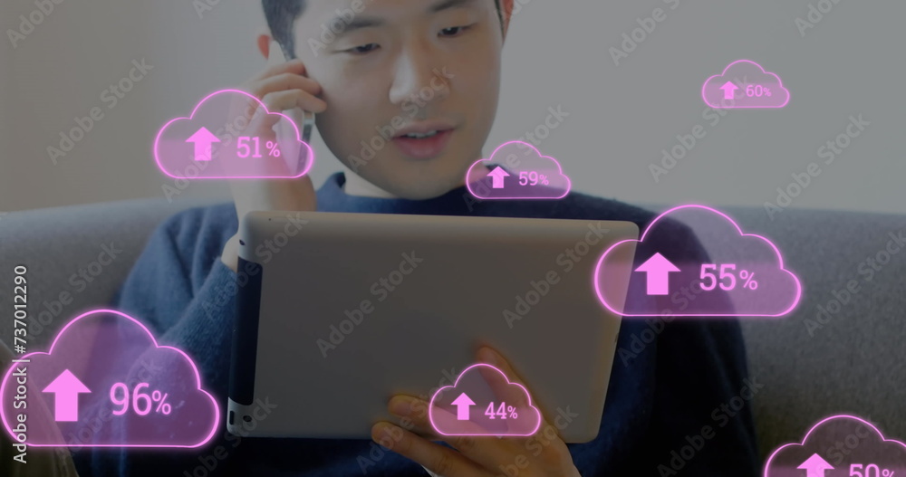 Poster image of digital interface with pink cloud icons and numbers growing over man talking on smartphone