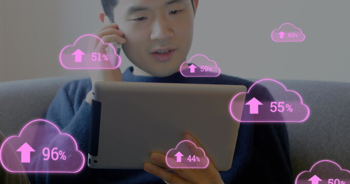 Image of digital interface with pink cloud icons and numbers growing over man talking on smartphone  - Powered by Adobe