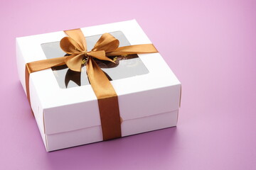 Chocolate cake in box. Gifts festive food love concept.
