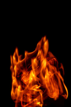 Fire flames isolated on a black backdrop. Abstract fire background.