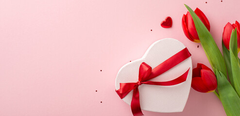Prime feminine event concept. Top view picture of a gift in heart shape, adorned with bow, sparkle,...