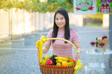 Beautiful asian woman in the flower garden with nature background.