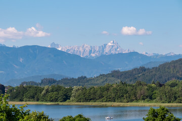 Lake Ossiach with panoramic view of untamed Julian Alps and Karawanks seen from Annenheim,...