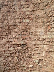 Vintage brick stone wall. brick stones of and ancient wall of a medieval castle or a fortress.