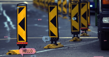 Image of multiple hi and hello text on vintage speech bubbles over road traffic
