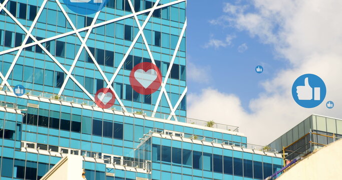 Image of multiple heart love icons over modern cityscape in background