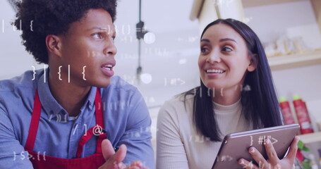 Image of data processing over diverse shop assistant and customer talking