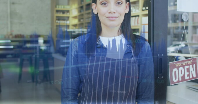 Image of data processing over caucasian female shop assistant smiling - Powered by Adobe