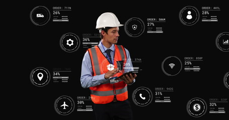 Image of icons with data processing over caucasian male worker using tablet - Powered by Adobe