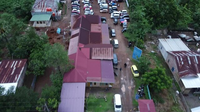 You can see several cars parked neatly next to residents' houses