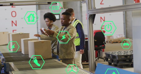 Image of eco icons and data processing over diverse people working in warehouse
