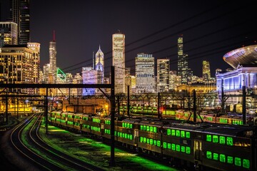 Chicago, Illinois, USA – City skyline view from 18th St West Pedestrian Bridge with train tracks...
