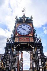 Fototapeta na wymiar Historic Eastgate Clock Tower Amidst Chester’s Architectural Beauty