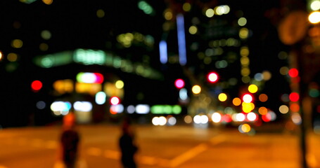 Fototapeta na wymiar Blurred city lights create a vibrant backdrop at night