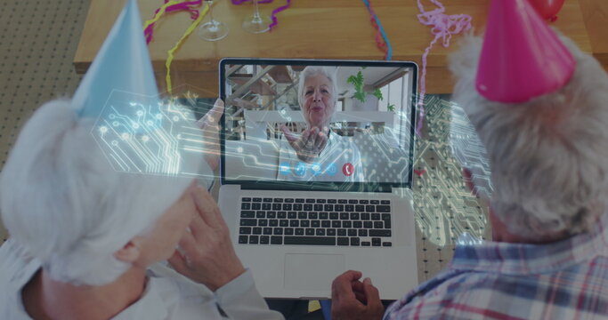 Microprocessor connections key icon against senior couple having a image call at home