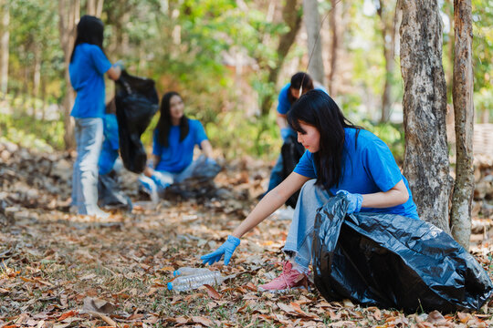 Volunteer team in nature for community service, teamwork and planning with leadership