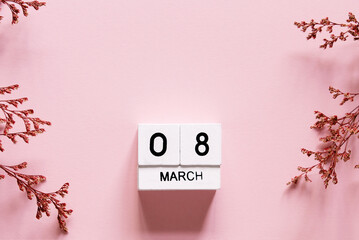 8 march wooden calendar with flowers on the pink background. Women's day composition. Copy space, top view - obrazy, fototapety, plakaty