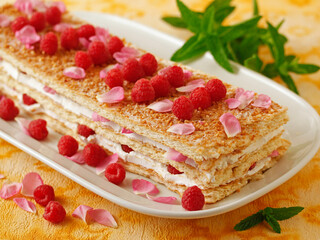 Millefeuille with raspberries and roses.