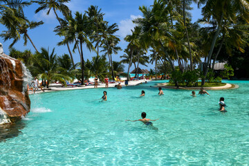 People practicing aqua aerobics at Villa Park resort on Ari atoll in Maldives - obrazy, fototapety, plakaty