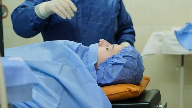 A girl on the operating table under anesthesia in the surgery department.