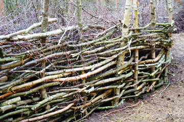 Fence made out of woven branches 