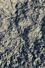 Silver crumpled aluminum foil flat background texture. Shiny metal silver gray foil crumpled texture background.