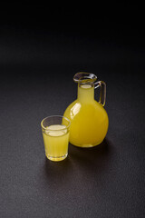 Alcoholic drink yellow limoncello in a small glass