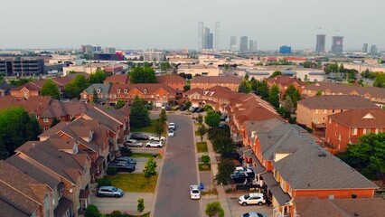 Drone view over typical North American houses, quintessence of family home in suburban areas....