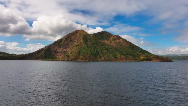 Taal Lake with gigantic Taal Volcano at cloudy day in Philippines. Aerial wide shot.