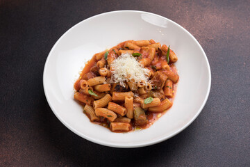 Rigatoni pasta with tomato sauce and parmesan cheese