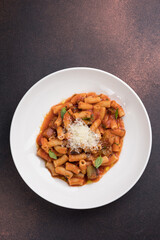 Rigatoni pasta with tomato sauce and parmesan cheese
