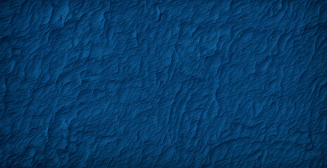 A blue wall with a rough texture is shown in this image
