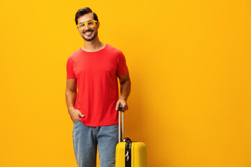 Man background flight studio vacation trip travel yellow traveler baggage journey happy suitcase