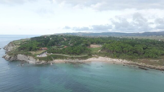 Mirador De Los Tranquilos lookout at the north end of Playa De Somo beach near Santander northern Spain, Aerial pan right shot
