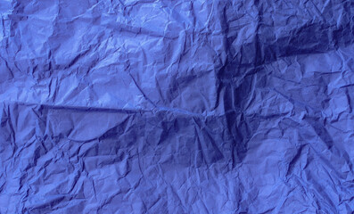 Crumpled craft tissue paper. Background. Blue color.