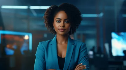 Foto op Plexiglas Portrait of confident african businesswoman on blue background © Yuwarin
