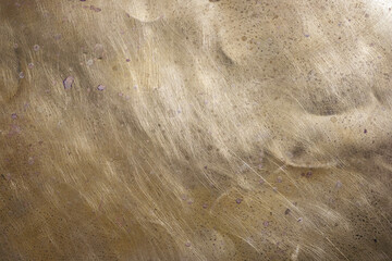 Brass background. Scratches. Stains. Copy space.