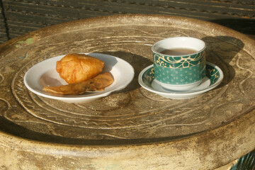 traditional breakfast set, traditional bread and a cup of hot tea