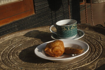 traditional breakfast set, traditional bread and a cup of hot tea