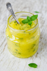 Homemade scrub with lemon, honey, sugar and mint. DIY cosmetics for face, foot and body. Natural...