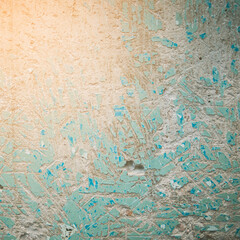 texture of a concrete wall with the problem of removing old oil paint from the surface coating, for further filling of the wall
