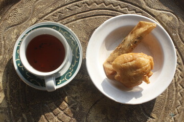 traditional breakfast set, traditional bread and a cup of hot tea