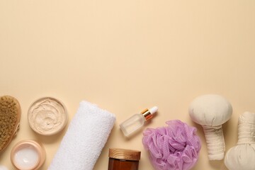 Obraz na płótnie Canvas Bath accessories. Flat lay composition with personal care products on beige background, space for text