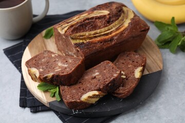 Delicious banana bread served on grey table, closeup