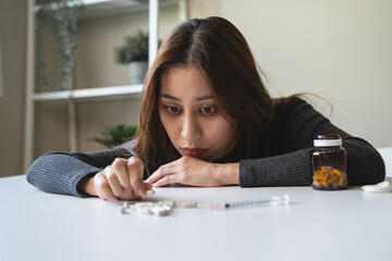 close up hand of young women. Stressed female taking drug overdose.