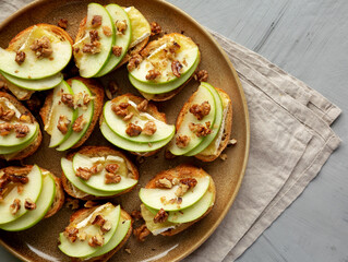 Homemade Apple Brie Crostinis on a Plate, top view.
